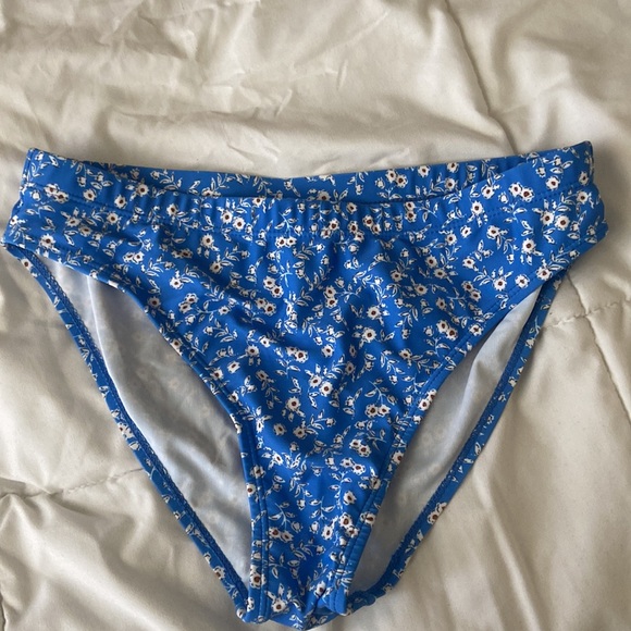 A medium size blue swimsuit with floral design. - Picture 5 of 7